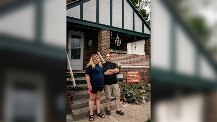 Kerry and Vicky Blacketer in front of their North Omaha home, where they have lived for nearly 16 years.