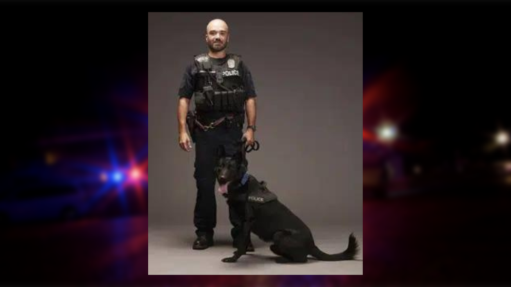 This image provided by the Kansas City, Mo., Police Department shows Police Officer James Muhlbauer and K-9 Officer Champ.