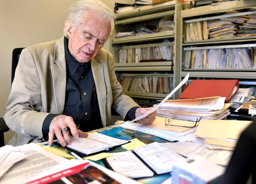 Nebraska broadcasting legend Ron Hull works at his desk at Nebraska Public Media on Feb. 3, 2023.