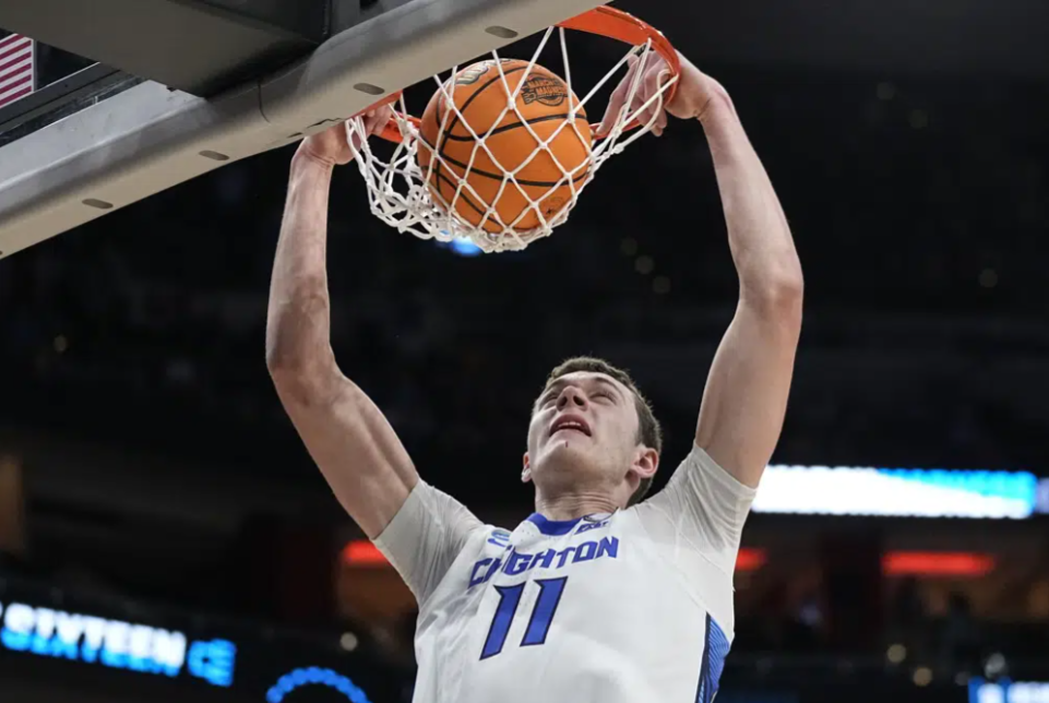 Creighton center Ryan Kalkbrenner (11) makes the dunk against Princeton in the second half of a Sweet 16 round college basketball game in the South Regional of the NCAA Tournament, Friday, March 24, 2023, in Louisville, Ky.