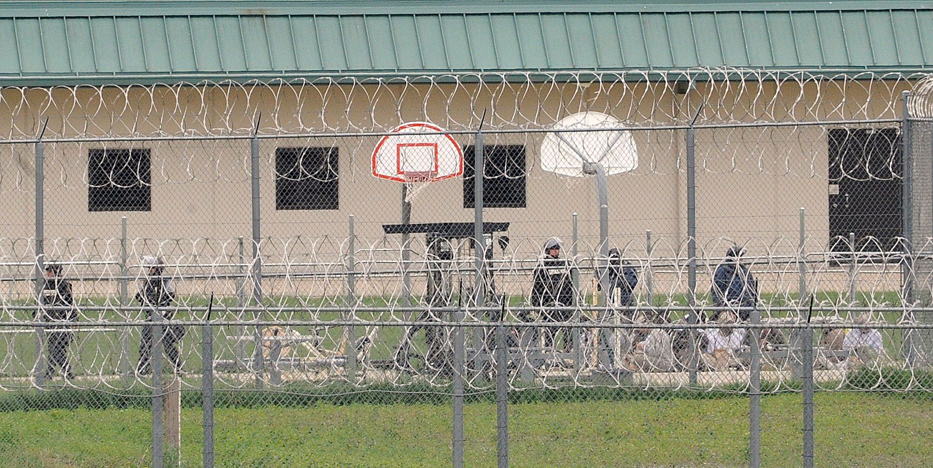 Officers guard inmates who are seated on a basketball court on the north side of the Tecumseh State Correctional Institution on Monday, May 11, 2015. Eric Gregory/Lincoln Journal Star file photo